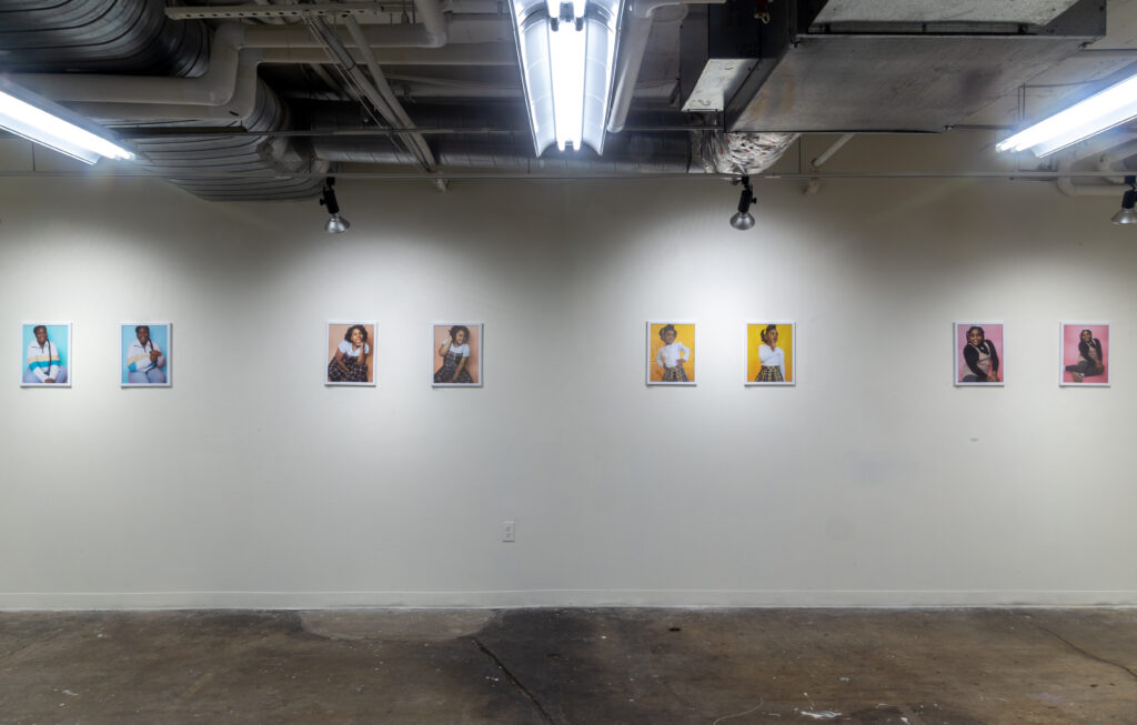 gallery with framed portraits hanging