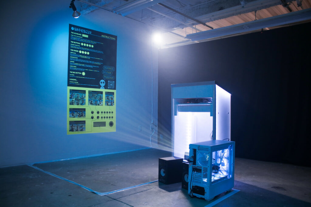 A graphic projected on the wall of a dark room by a computer