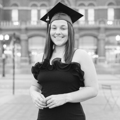 woman smiling in 2024 graduation cap